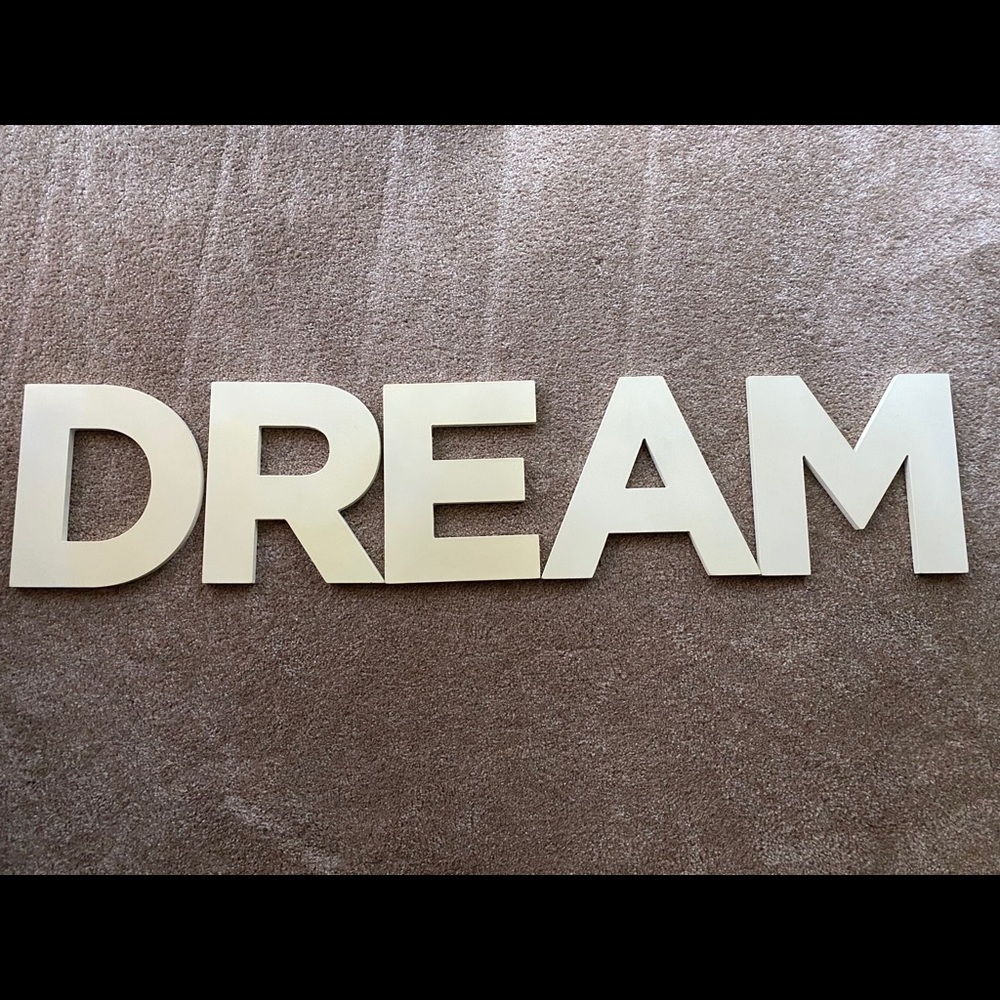 The letters DREAM